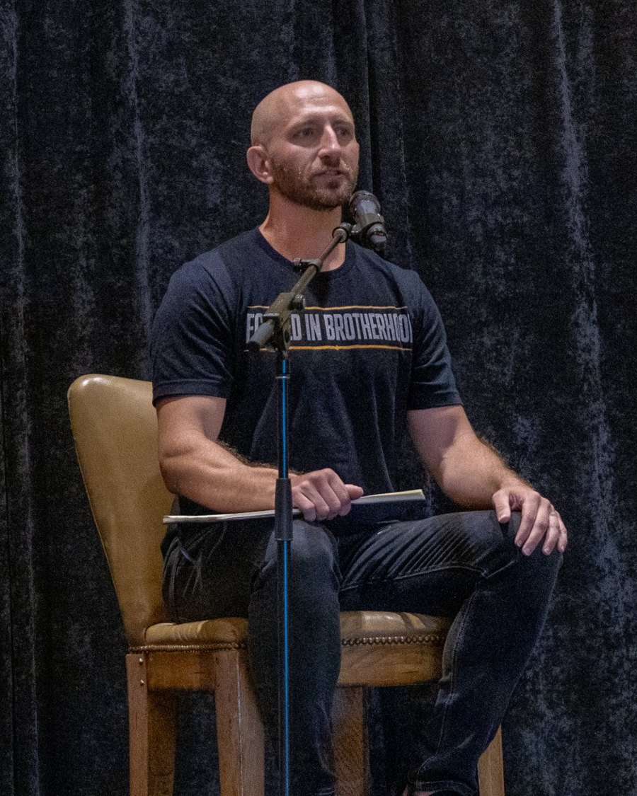 JR Harvey speaking on stage